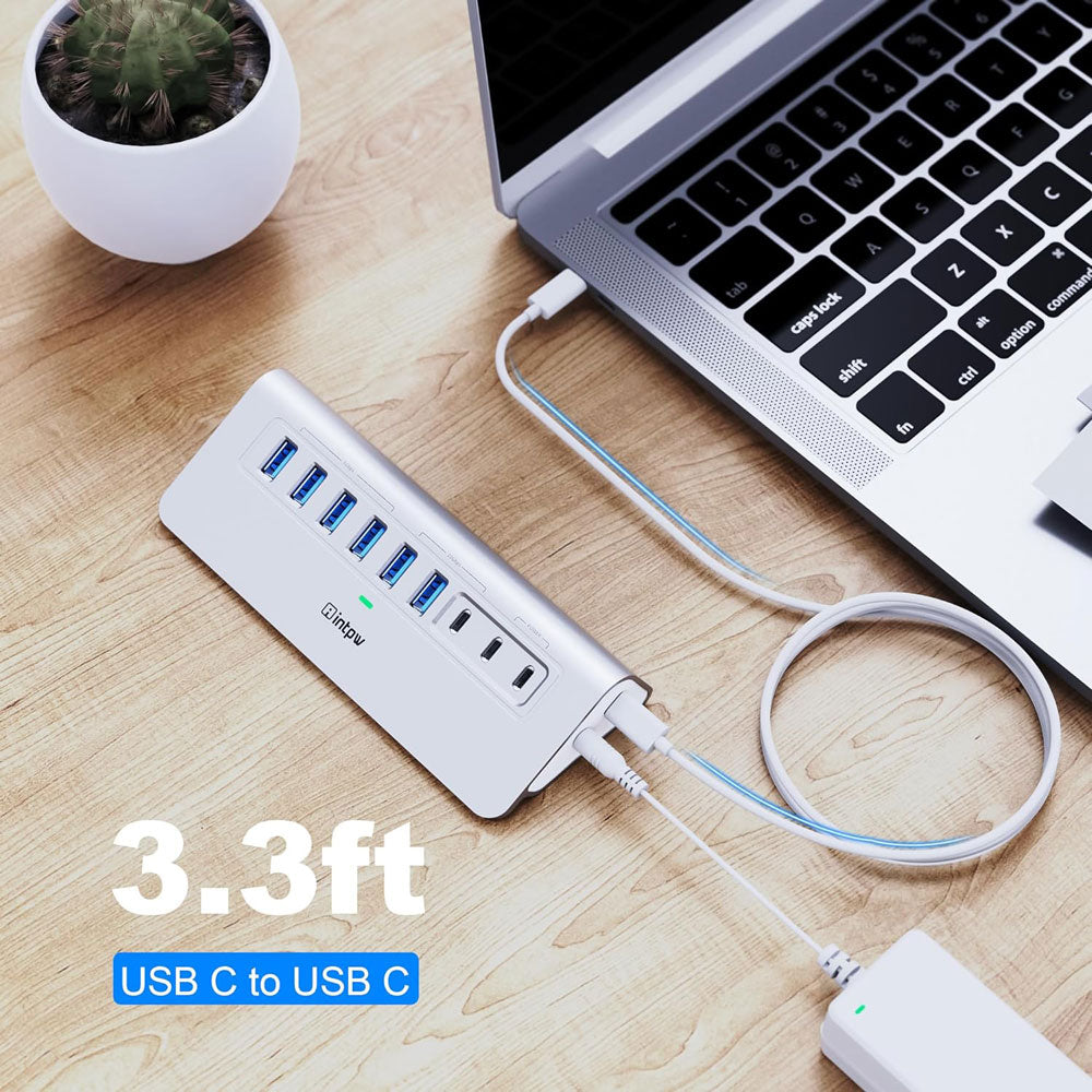 a silver intpw yh6ac powered usb hub connects the laptop with 3.3ft usb c cable.